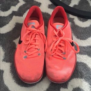 pink nike athletic shoes